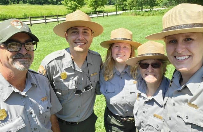 Lauren Ray, far right, smiles alongside other park rangers.