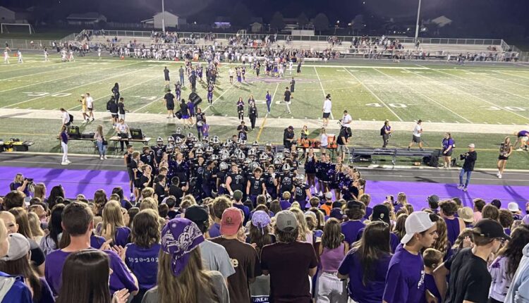 The Riverton football team celebrates in front of the student section Friday. 
