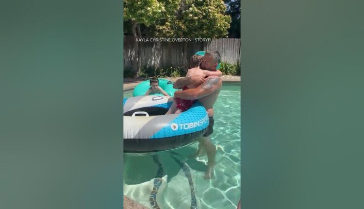 Father and son emotional after learning adoption is finalized