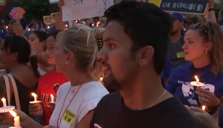 Nurses on strike at Robert Wood Johnson hold candlelight vigil