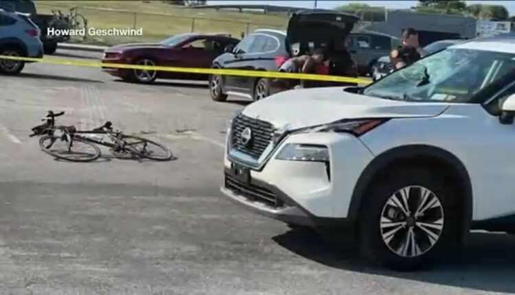 Woman accused of striking bicyclist during triathlon